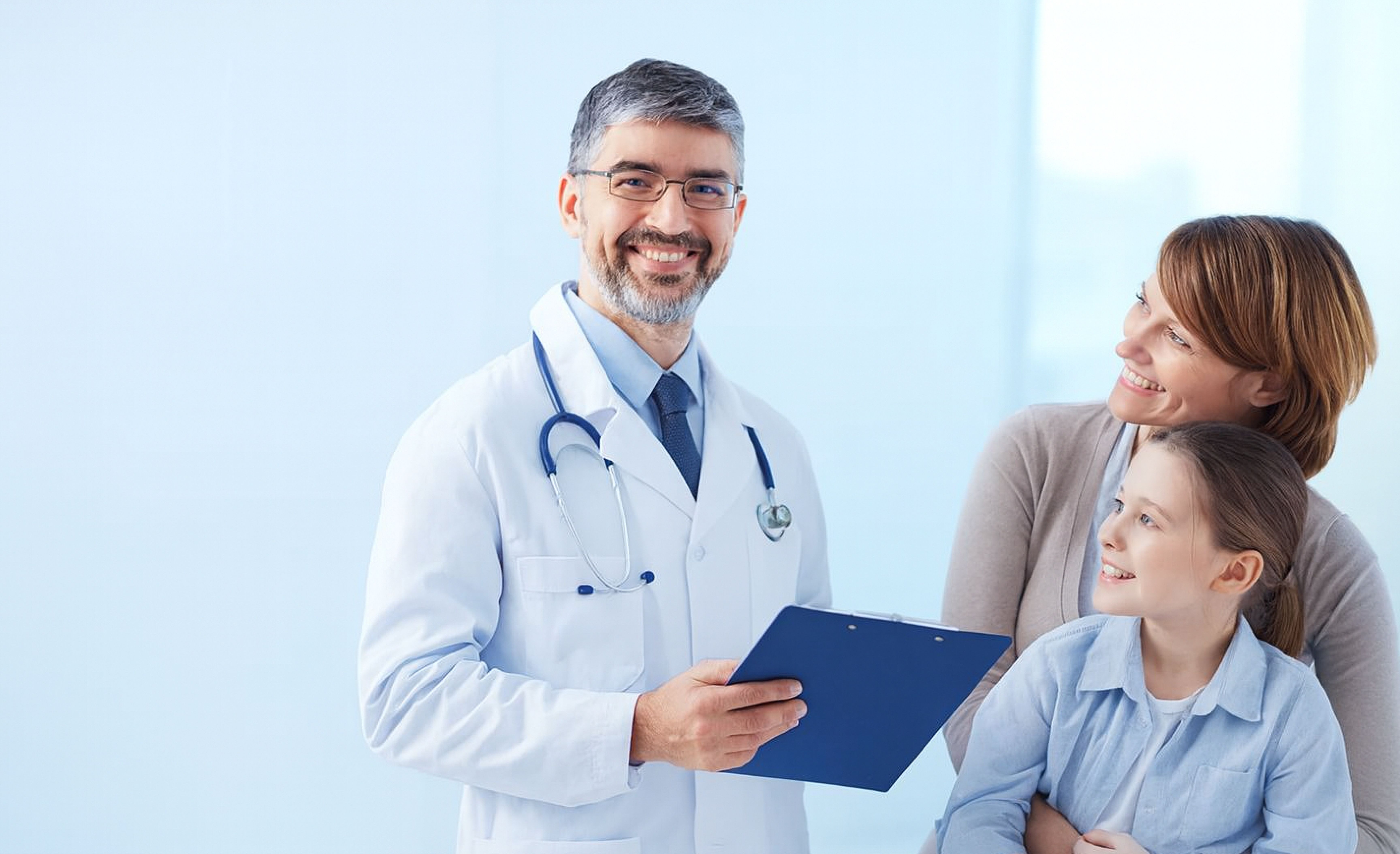 Doctor providing telehealth care to family